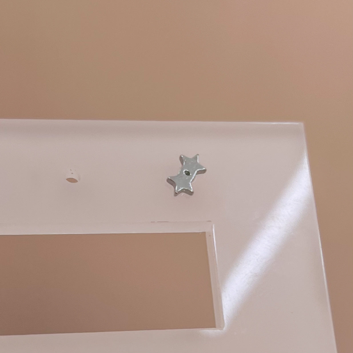PIERCING DOBLE ESTRELLA
